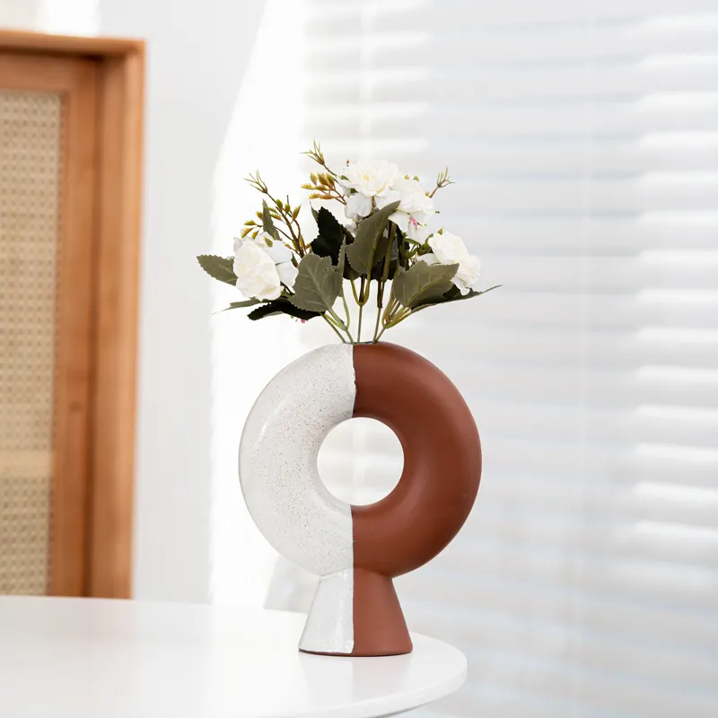 Porcelana Cute Bud Vase Pequeno Oval Esmalte Areia Oco Out Vaso De Flor De Cerâmica Vaso De Flor De Casamento Moderno decoração de casa