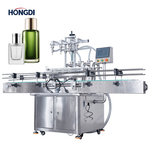 Máquina de llenado automática de sobremesa de 4 cabezales con bomba peristáltica y transportador para bebidas, alimentos y aceite, de alta precisión, para botellas y bolsas con llenado remoto - Product Image 1