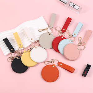 Latest Promotion Classic Round PU Leather Makeup Mirror Portable Rotating Small Mirror Pendant Strap Keychain Custom Logo
