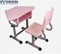 Bureau et chaise d'école trapézoïdaux collaboratifs modernes pour la salle de classe avec design ergonomique papillon pour les enfants de maternelle et de primaire