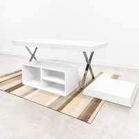 Table de présentation noire avec pieds en X chromés, meuble îlot bas commercial pour vêtements