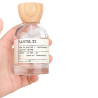Flacon pulvérisateur de parfum rond en verre transparent rechargeable avec bouchon en bois 30ml/50ml/100ml pour emballage cosmétique et parfum, OEM/ODM disponible