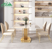 Ensemble de table à manger Wayon Luxury Gold avec plateau en pierre frittée brillante, base géométrique en métal et chaises rembourrées