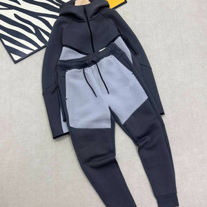 إصدار جديد 2026 بدلة رياضية رجالية عالية الجودة من القطن التقني، ماركة أزياء، طقم من قطعتين، سترة وبنطلون رياضي بتصميم مرقع - Product Image 1