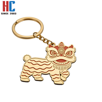 Porte-clés artisanal commémoratif du Festival du Printemps, motif Danse du Lion chinois, en métal émaillé plaqué or moderne, personnalisé, de fabrication usine avec 23 ans d'expérience