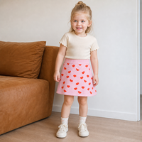 Jupe en tricot rose pâle pour filles, motif cœur, coupe trapèze, mini-jupe tricotée douce et chaude pour tout-petits, jupe pull Saint-Valentin pour enfants, vente en gros