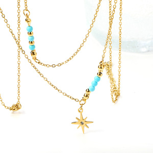 Collar de doble cadena dorado de estilo europeo y americano con colgante de estrella y cuentas azules para mujer - Product Image 3