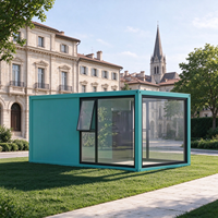 Maison en verre moderne, préfabriquée, modulaire, avec structure en acier, fenêtre à auvent et porte solide, idéale pour jardin, villa, complexe hôtelier ou gîte.