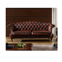 Canapé classique en cuir véritable, style Chesterfield antique, pour salon européen.