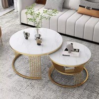 Ensemble de tables basses rondes modernes de luxe, table centrale imbriquée avec plateau en pierre frittée et structure métallique pour salon et hôtel