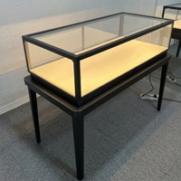 Comptoir de présentation de bijoux de luxe en acier inoxydable noir avec dessus en verre, éclairage LED, vitrine d'exposition verrouillable pour montres