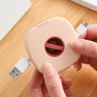 Petit boîtier d'enrouleur de gestion de câble en plastique organisateur de cordon de charge pour téléphone câble de chargeur de fil de souris de casque USB