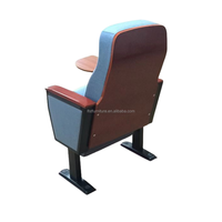 Chaise de théâtre ergonomique à base fixe avec dossier haut et tablette pliable, conçue pour les projets scolaires et de conférence