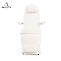 Fauteuil de beauté moderne et confortable en cuir PVC blanc, lit de massage électrique avec dossier et repose-jambes réglables pour salon de beauté et salon.