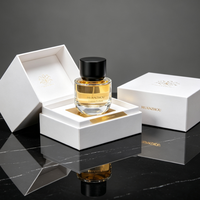 Vente en gros de flacons de parfum en verre transparent à pression haute de 50 ml avec bouchon noir mat, logo de marque personnalisé et boîte cadeau