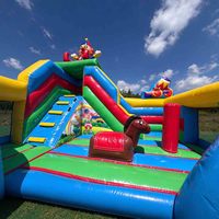 Château gonflable robuste de qualité commerciale sur le thème du clown de cirque joyeux et coloré pour les fêtes d'enfants et les carnavals