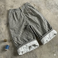 Pantalon court unisexe personnalisé en nylon et polyester avec bande latérale, coupe ample et oversize, idéal pour l'été, style jogger ou short de sport pour homme