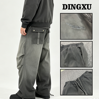 Pantalon cargo large pour homme, gris vert délavé, coupe ample, cordon de serrage à l'ourlet, poches à rabat arrière, boutons-pression, style utilitaire