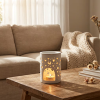 Brûleur d'huiles essentielles en céramique blanche en gros avec un design creux en forme de cœur pour diffuseur de parfum d'intérieur