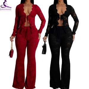 Completo <span class=keywords><strong>Sexy</strong></span> da Donna in Pizzo a Due Pezzi: Top Corto Trasparente a Maniche Lunghe e Pantaloni a Zampa, Set Coordinato Trasparente - Product Image 1