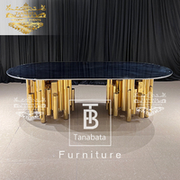Table et chaises de salle à manger de luxe 12 places base en acier inoxydable doré avec plateau en verre noir