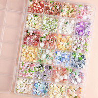 Meilleure vente en vrac 3D Rose fleurs papillon arc perle camélia résine ongles breloques bijoux accessoires Kawaii 24 grille ongles breloques