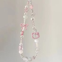 Dragonne de téléphone perlée rose avec breloque cœur, nœud et fleur en acrylique, en acier inoxydable, pour sac à main et sac à dos