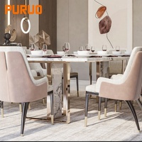 Table à manger ovale Puruo Light Luxury avec plateau asymétrique sur une base de table à manger à 3 pieds en or massif