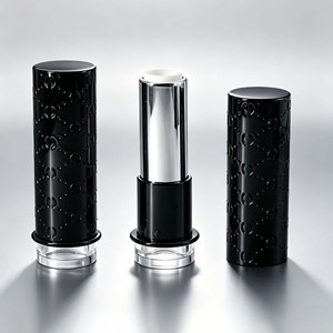 Tube à lèvres vide de luxe rond noir gaufré avec logo personnalisé, conteneur rotatif pour baume à lèvres cosmétique avec base transparente - Product Image 1