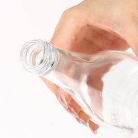 Fabrication de bouteilles en verre Evian 330ml 500ml 750ml bouteilles en verre Super Flint Water & Juice sérigraphiées avec bouchon à vis