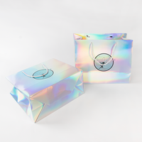 Sac fourre-tout en papier avec surface laser scintillante et poignée personnalisée, sacs en papier de luxe personnalisés pour boutique de mode