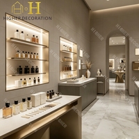Kiosque de présentation de parfums personnalisé avec éclairage LED, comptoir de présentation de parfums, salle d'exposition intérieure de parfums