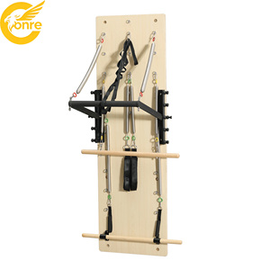 Tabla de entrenamiento de Pilates montada en la pared, ajustable y duradera, de venta directa de fábrica, máquina de pared multifuncional de madera con resortes para entrenamiento corporal - Product Image 1