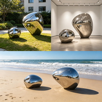 Sculpture abstraite en acier inoxydable poli miroir, forme de galet métallique, pour la décoration extérieure de jardin et de paysage