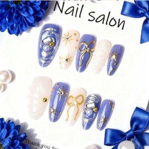 24 faux ongles amande plaqués or faits main, style INS, avec étoiles 3D, nœuds et strass à coller pour manucure - Product Image 2