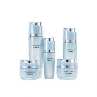 Flacon pulvérisateur de sérum et pots de crème en verre vert jade à couvercle incliné asymétrique 120ml 100ml 40ml 50g 30g Fournisseur à faible MOQ