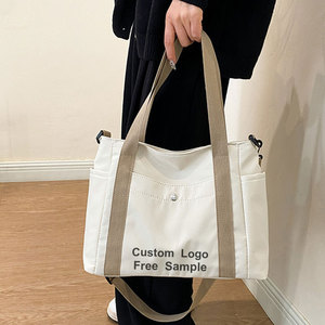 Logo personnalisé toile <span class=keywords><strong>sac</strong></span> fourre-tout femmes 2025 nouveau grand <span class=keywords><strong>sac</strong></span> à provisions Style coréen <span class=keywords><strong>sac</strong></span> à bandoulière pour l'école de <span class=keywords><strong>travail</strong></span> en gros <span class=keywords><strong>pas</strong></span> <span class=keywords><strong>cher</strong></span> prix - Product Image 2
