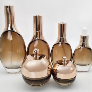 Juego de Botellas Redondas de Vidrio Vacías de Lujo de la Serie Marrón de 150 ml, 120 ml, 100 ml y 50 ml, con Bomba Dosificadora, Gotero, Tapa y Frascos de Vidrio - Product Image 1