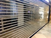 Rideau de magasin antivol de centre commercial Portes coulissantes transparentes et horizontales en acier inoxydable