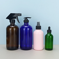 Flacon pulvérisateur en verre transparent ambré Boston rond de 500 ml/16 oz, vide et rechargeable, avec pompe pulvérisatrice à gâchette.