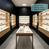 Meuble de magasin d'optique moderne à LED, vitrine murale en bois pour lunettes, prix d'usine, présentoir personnalisé pour magasin de lunettes