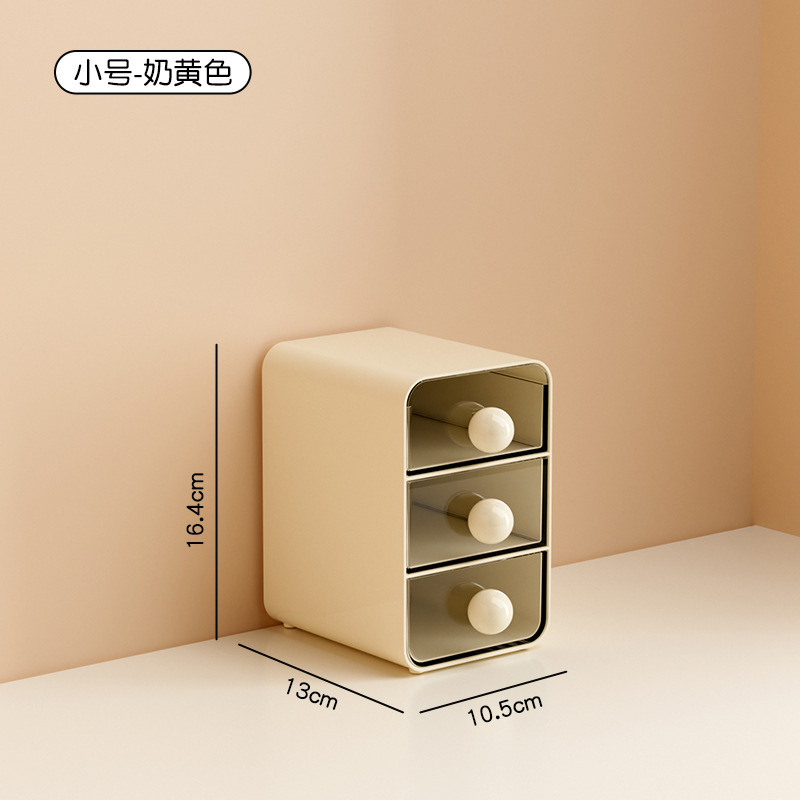 Small, cream-colored [three drawers]