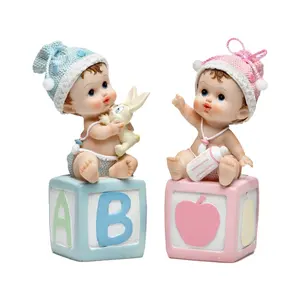Figurita artística de resina para bebé, niño y niña, recuerdo para bautizo, nacimiento, ducha de bebé, primera crema, rosa, azul, venta al por mayor