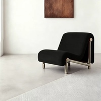 Fauteuil lounge moderne en tissu durable avec structure en acier inoxydable, mobilier pour salons, hôtels, villas. Couleurs personnalisables.
