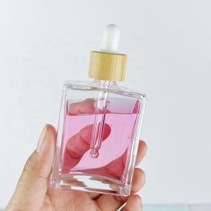 ขวดน้ำมันหอมระเหยราคาโรงงาน สีตามสั่ง พิมพ์โลโก้ด้วยผ้าไหม 30 มล. 50 มล. 100 มล. ขวดทรงสี่เหลี่ยมฝ้าพร้อมฝาหยด - Product Image 2