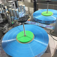 Machine d'étiquetage à colle thermofusible haute vitesse pour bouteilles d'eau minérale et de boissons, étiqueteuse enveloppante pour bouteilles, contrôle PLC