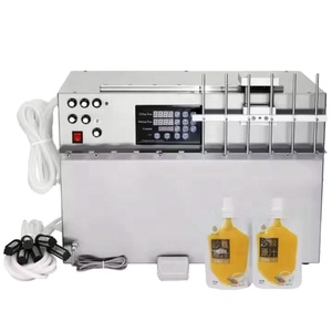 Fruit <b>Juice</b> Liquid Bottle Semi Automatic <b>Juice</b> Bottle Filling <b>Machine</b> Used 4 Nozzle Filling <b>Machine</b> Multi-jet Filling <b>Machine</b> - Product Image 3