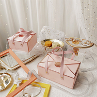 Boîte à gâteaux ondulée pliante de luxe Boîte d'emballage cadeau souvenir de bonbons au chocolat avec poignée en cuir