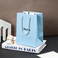 Sacs en papier d'emballage de luxe personnalisés en gros avec votre propre logo, tendance pour la vente au détail, sacs en papier cadeau avec poignée