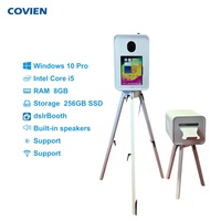 Cabina de Fotos con Pantalla Táctil de 18.5 Pulgadas, Patas Plegables y Soporte de Cámara Ajustable, Compatible con iPads y Cámaras DSLR